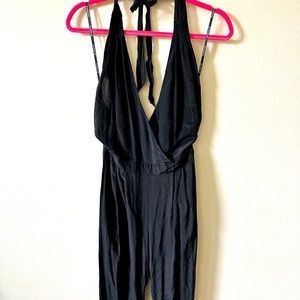 Size medium jumpsuit, and the color black